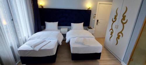 Postel nebo postele na pokoji v ubytování BOSS To HOTEL TAKSİM
