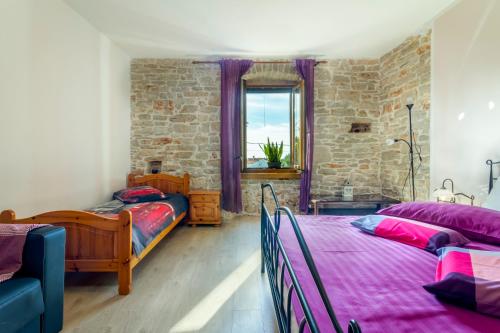 Posteľ alebo postele v izbe v ubytovaní Holiday stone house