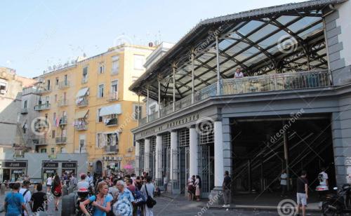 a crowd of people standing outside of a building at B&B La Cumana in Naples
