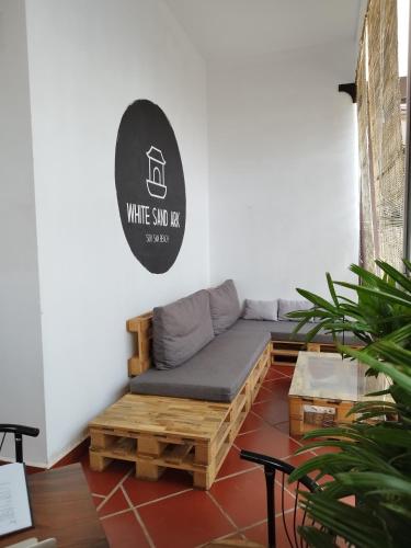 a room with a couch and a sign that reads white sod nap at WHITE SAND ARK RESORT in Koh Rong Island