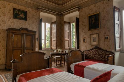 Postel nebo postele na pokoji v ubytování Albergo Real Castello