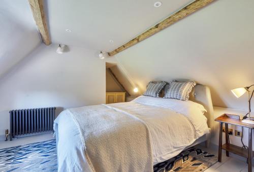 En eller flere senge i et værelse på Hilltop Cottage