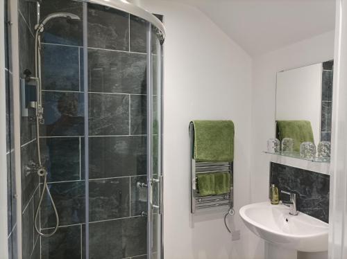 a bathroom with a shower and a sink at Victorian Renovation Room 5 in Liverpool