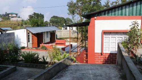 a view of a house with a garage at K & K INN in Cherrapunji