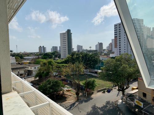a view of a city from a balcony of a building at Flat Apart America Campos in Campos dos Goytacazes