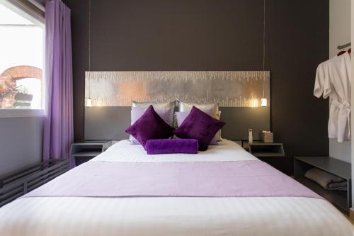 Ein Bett oder Betten in einem Zimmer der Unterkunft ArcoSodi Hotel Boutique