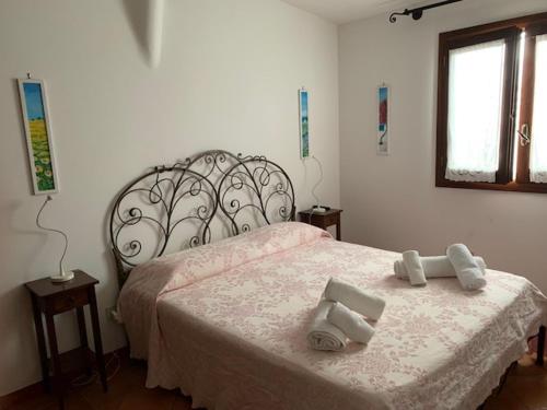Ένα ή περισσότερα κρεβάτια σε δωμάτιο στο Villa Vetti