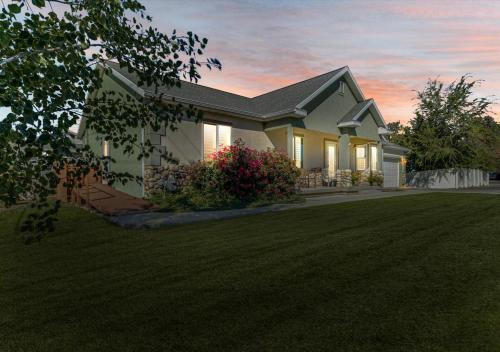 a house with a large lawn in front of it at Play & Gather in Luxury,Pets too! Close to it Everything! in Orem
