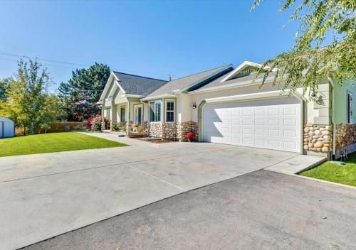 a house with a driveway and a garage at Play & Gather in Luxury,Pets too! Close to it Everything! in Orem