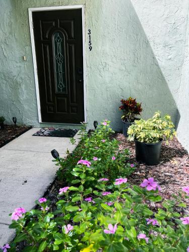 a bunch of flowers in front of a door at Hello Sunshine 321... Lift Off in Titusville