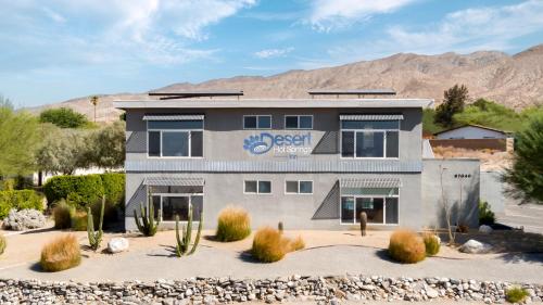 a building with a desert survey sign on it at Desert Hot Springs Inn in Desert Hot Springs