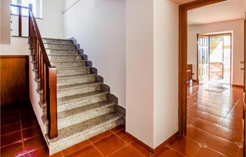 a staircase in a house with a tile floor at 5 Bedroom Beautiful Home In Giove in Giove