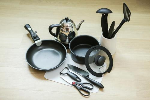 a bunch of utensils sitting on a table at PrimeRoom別府 GRANMAJESTA in Beppu