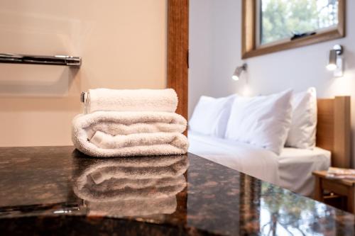 a pile of towels sitting on a counter in a room at Freycinet Stone Studio 6 - Mica in Coles Bay