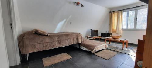 Un pat sau paturi într-o cameră la Entre Cardos y Nieves