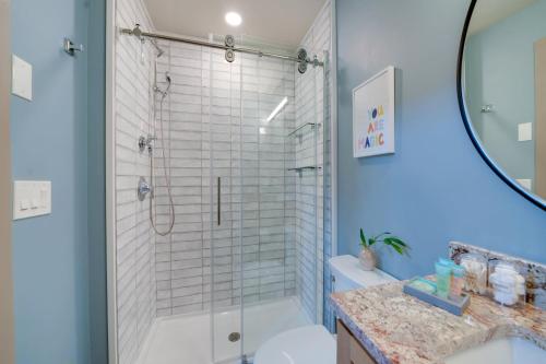 a bathroom with a shower and a toilet and a sink at A newly built Tiny House in the center of Historic Kennett Square in Kennett Square