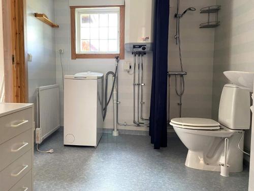 a bathroom with a toilet and a shower in it at Holiday home GAMLEBY VI in Gamleby