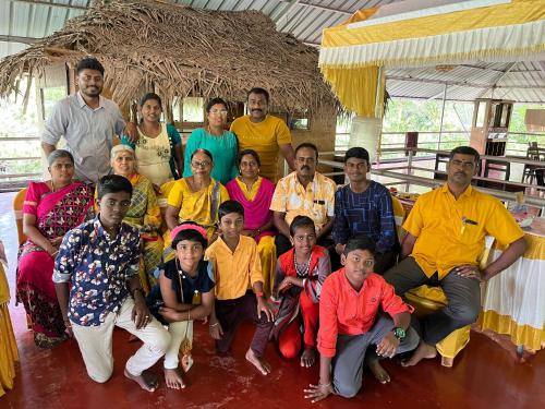 a group of people posing for a picture at Marari Beach Villas in Mararikulam
