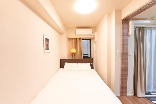 En eller flere senger på et rom på HIZ HOTEL - Vacation STAY 08964v