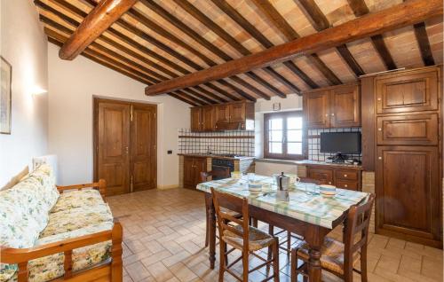 a living room with a table and a couch at Mandorli in Monte Santa Maria Tiberina