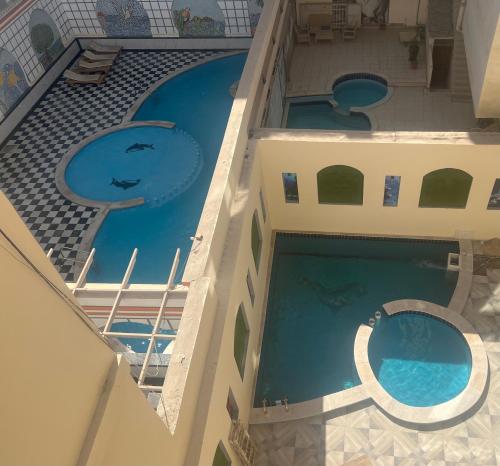 an overhead view of a swimming pool in a building at MARINA SKY in Hurghada