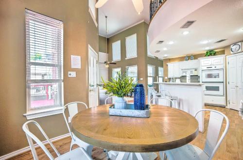 a kitchen and dining room with a wooden table and chairs at Beautiful Montgomery Home with Lakefront Deck! in Montgomery