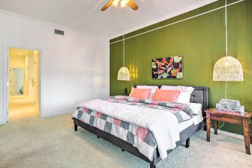 a bedroom with a bed and a green wall at Beautiful Montgomery Home with Lakefront Deck! in Montgomery