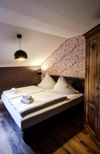 Ένα ή περισσότερα κρεβάτια σε δωμάτιο στο Hotel Schmiedhubers