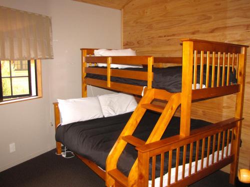 a bedroom with two bunk beds in a cabin at Ngauruhoe Yurt - Ohakune Holiday Home in Ohakune