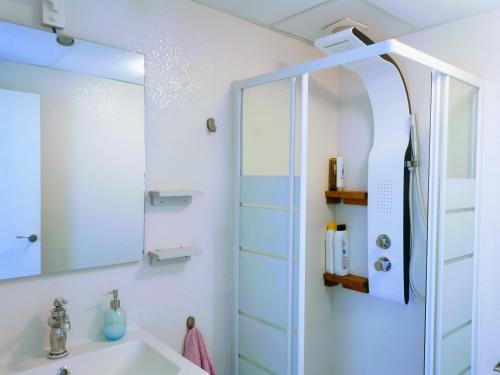 a bathroom with a sink and a mirror at ABA DALÍ in Conil de la Frontera