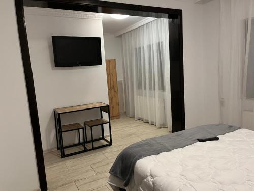 Postel nebo postele na pokoji v ubytování Casa Mocanitei