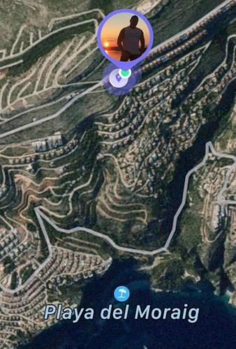 a man sitting on top of a map at VISTA SUPERIOR hola ZEEZICHT!! in Cumbre del Sol