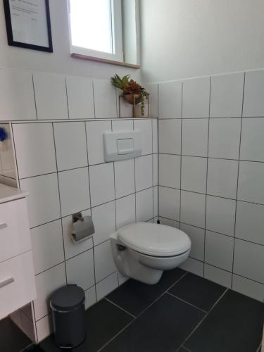 Ванная комната в Ferienwohnung in Fuldatal bei Kassel
