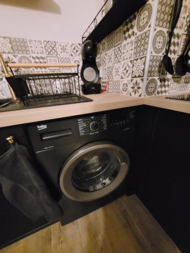 Kuchyňa alebo kuchynka v ubytovaní Appartement rénové près république