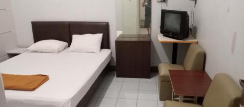 Letto o letti in una camera di HOTEL MAYA