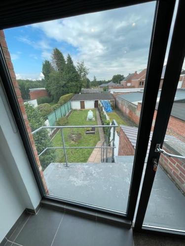 a view of a balcony from a window at Cosy flat for 4 p. with garden in Tremelo in Tremelo