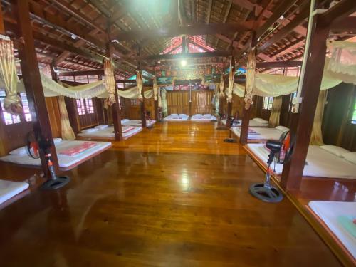 a room with several bunk beds in a house at Bac Son Homestay in Bắc Sơn