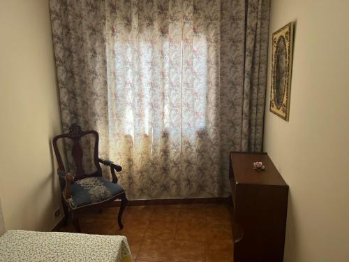 a room with a window with a chair and a table at Alma In the heart of the Vilaflor! Self check in 24h in Vilaflor