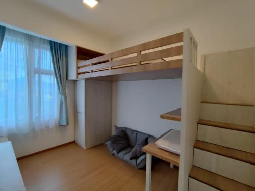 a small room with a bunk bed and a window at Mint Cabin @ Oasis Condo Ipoh in Ipoh