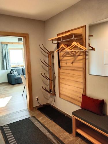 a room with a closet with antlers on the wall at Apart Bergauf in Rohrberg