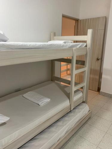 a couple of bunk beds in a room at Cabaña 8 Arrecifes in Coveñas