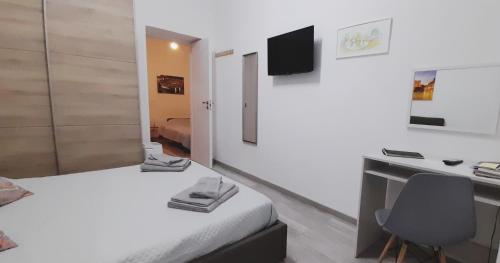 Televízia a/alebo spoločenská miestnosť v ubytovaní Rosina's flat