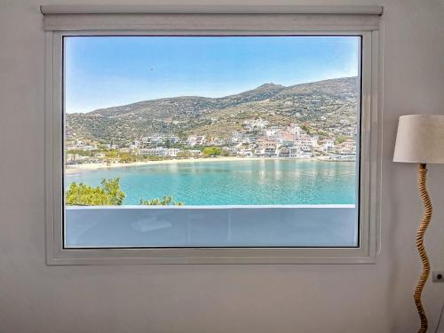 a window with a view of a beach at Galazio Rooms & Suites in Batsi