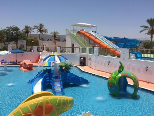a water park with a water slide and slides at Gafy Resort Aqua Park in Sharm El Sheikh