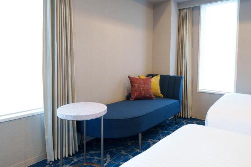 Un ou plusieurs lits dans un hébergement de l'établissement Hotel GrandConsort Naha