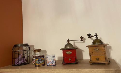 a shelf with three different types of items on it at LA MAISON IM in Avignon