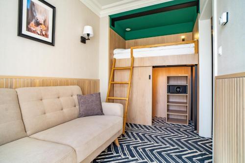 a living room with a couch and a bunk bed at Santa Natura Resort & SPA in Nowa Wieś