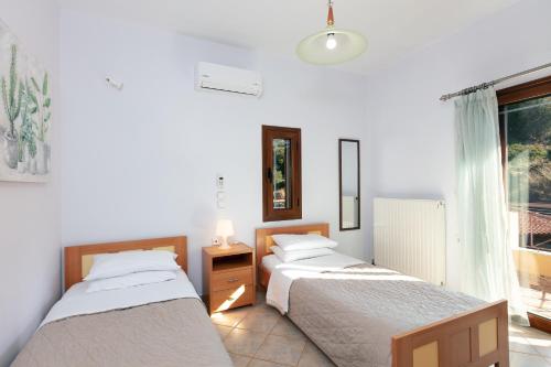 Ένα ή περισσότερα κρεβάτια σε δωμάτιο στο Villa Sevdas