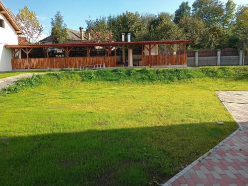 a yard with a pavilion in the back of a house at MONADIN Villa Relax & Spa in Săcele