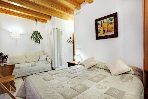 Postel nebo postele na pokoji v ubytování Locanda Delle Acque